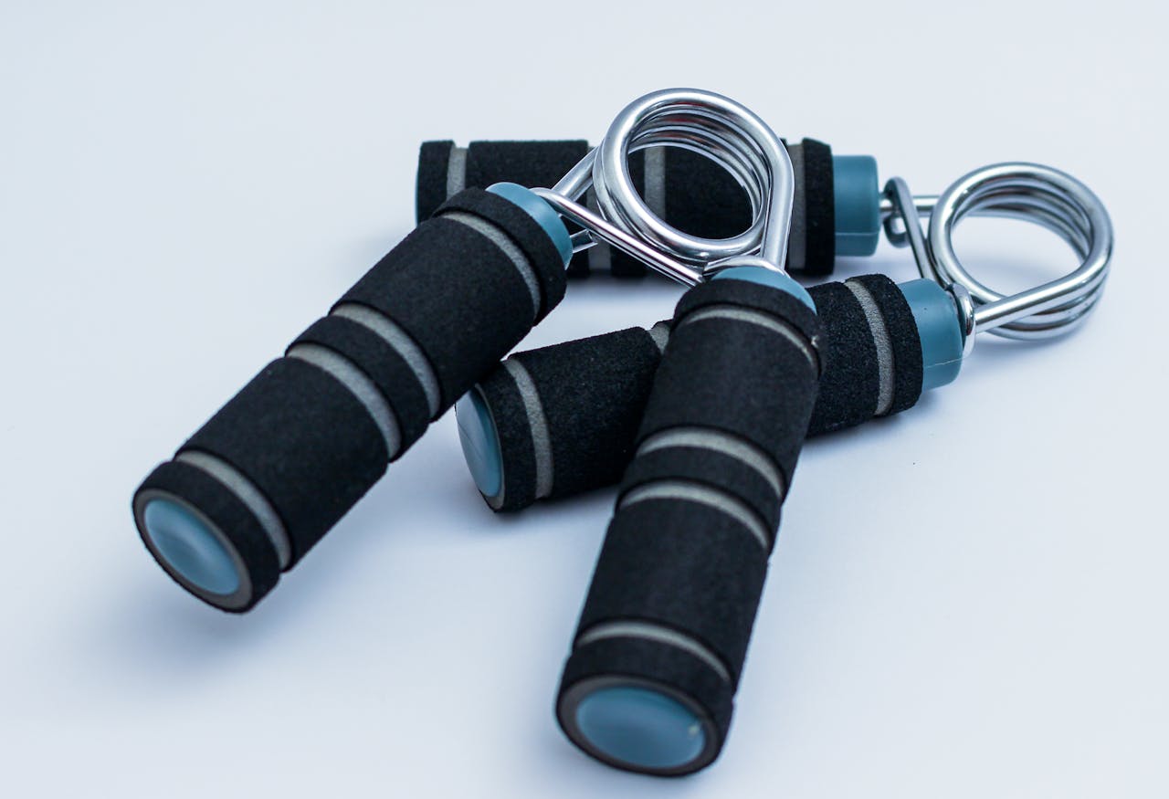 Close-up of foam handle hand grippers for enhancing grip strength during workouts.